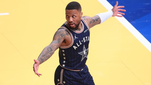 Eastern Conference guard Damian Lillard of the Milwaukee Bucks reacts after making a three-point basket from half court against the Western Conference All-Stars during the third quarter in the 73rd NBA All-Star Game at Gainbridge Fieldhouse in Indianapolis on Feb. 18, 2024.